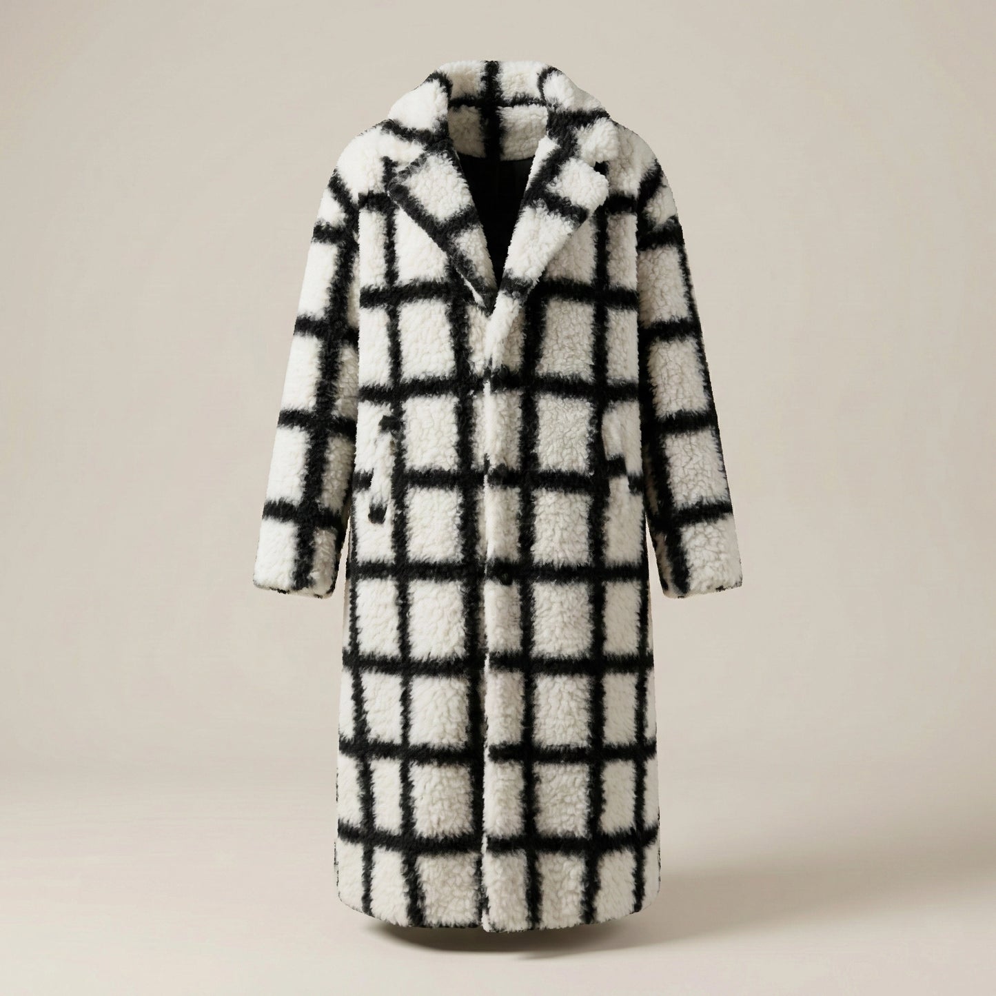 Plaid patterned coat on a beige background