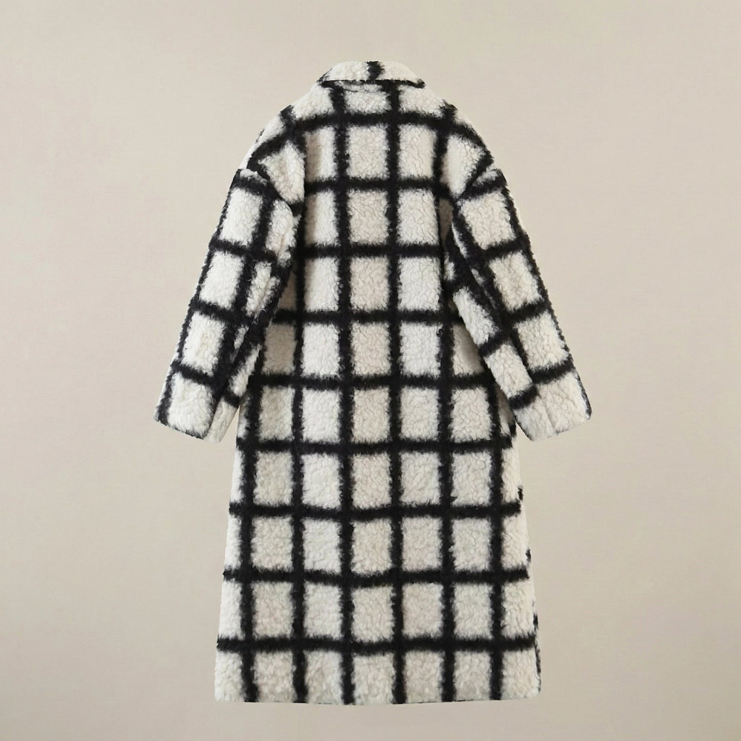 Black and white checkered coat on a beige background