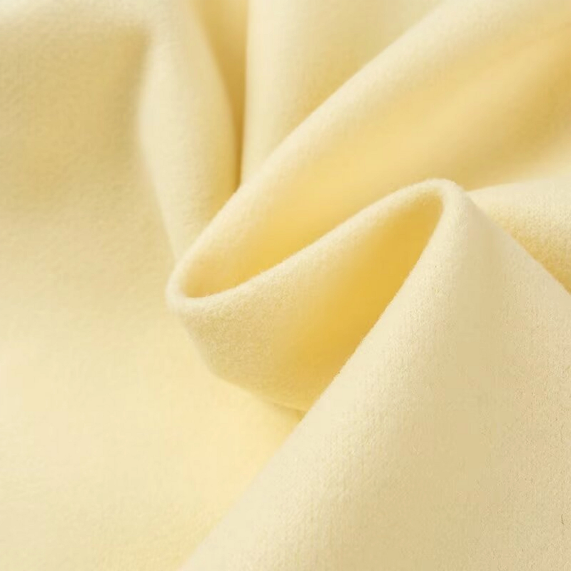 Close-up of beige fabric with folds