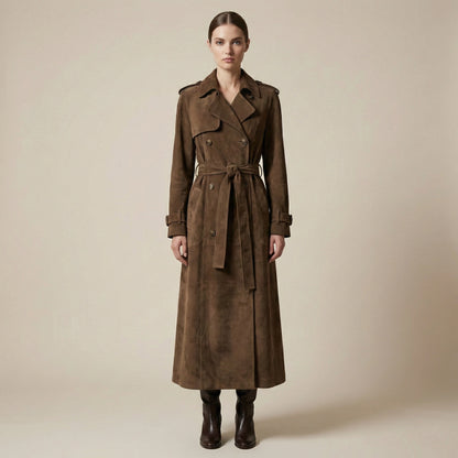 Woman wearing a brown trench coat on a beige background