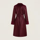 Maroon trench coat on a beige background