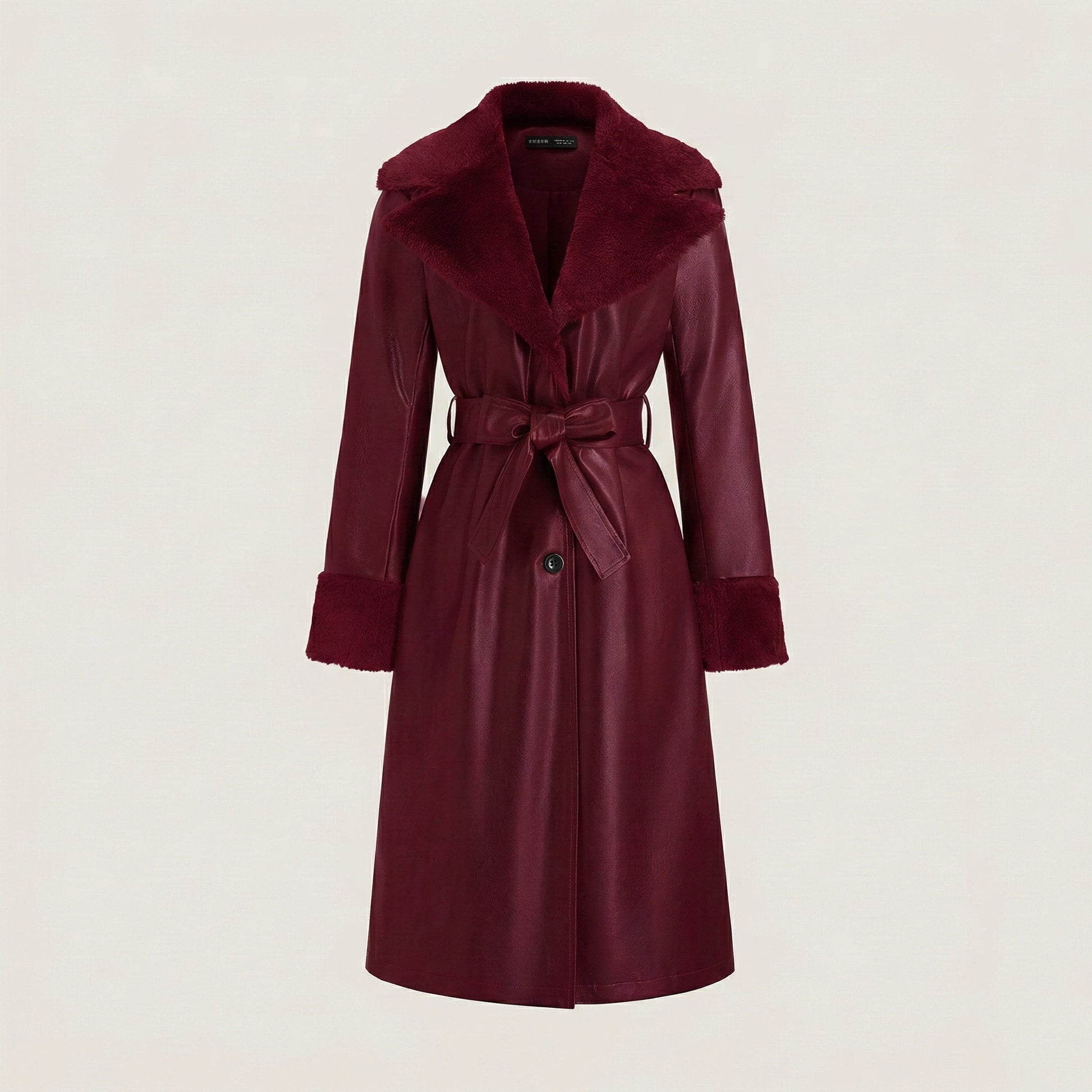 Maroon coat with a belt on a light beige background