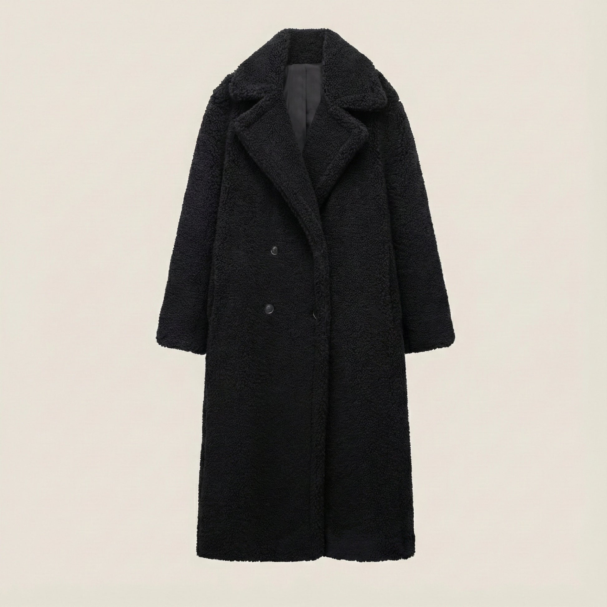 Black coat on a beige background