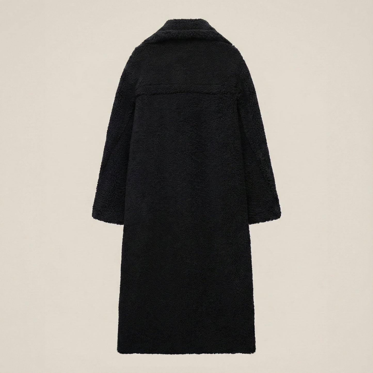 Black coat on a beige background