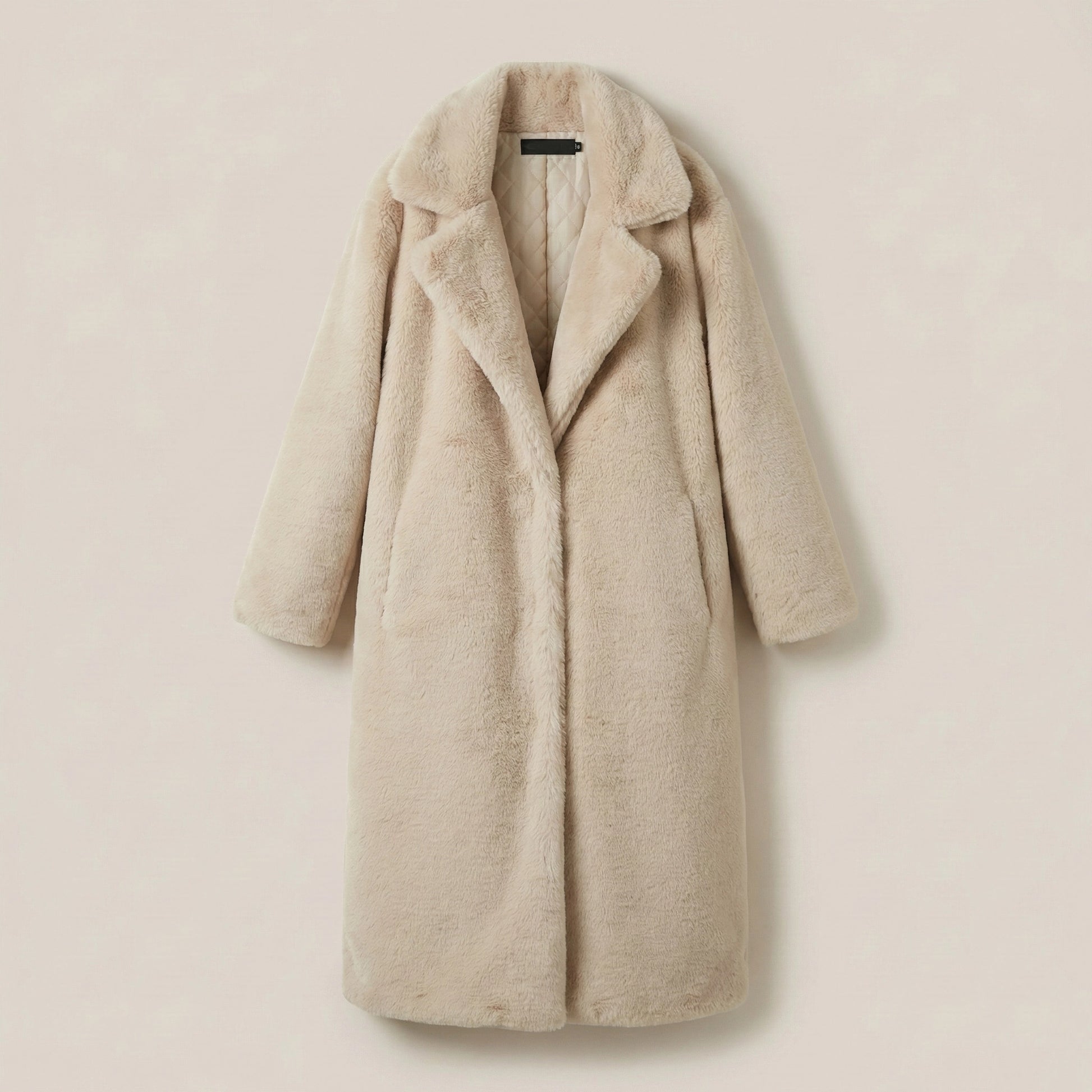 Beige coat on a beige background