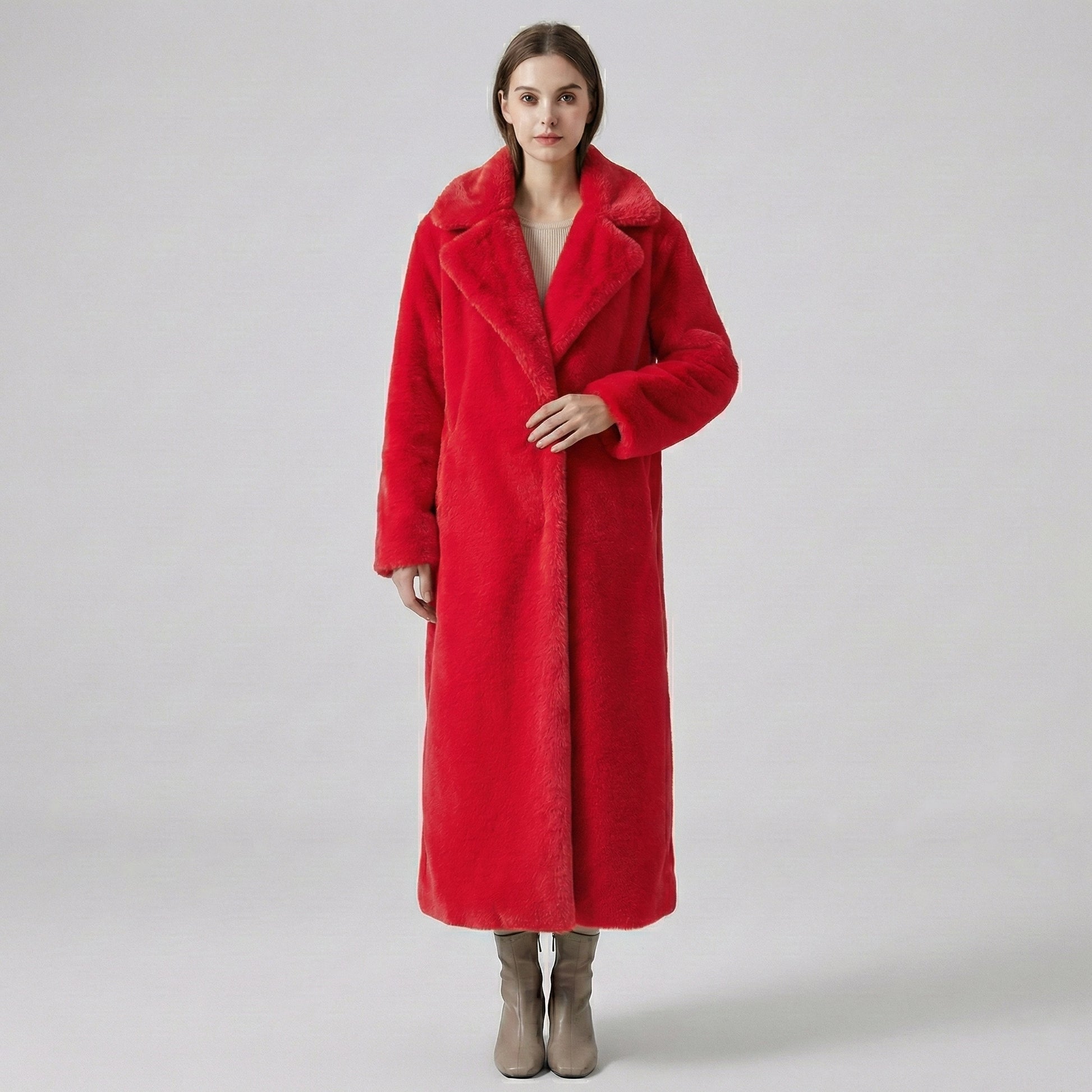 Person wearing a red coat on a plain background