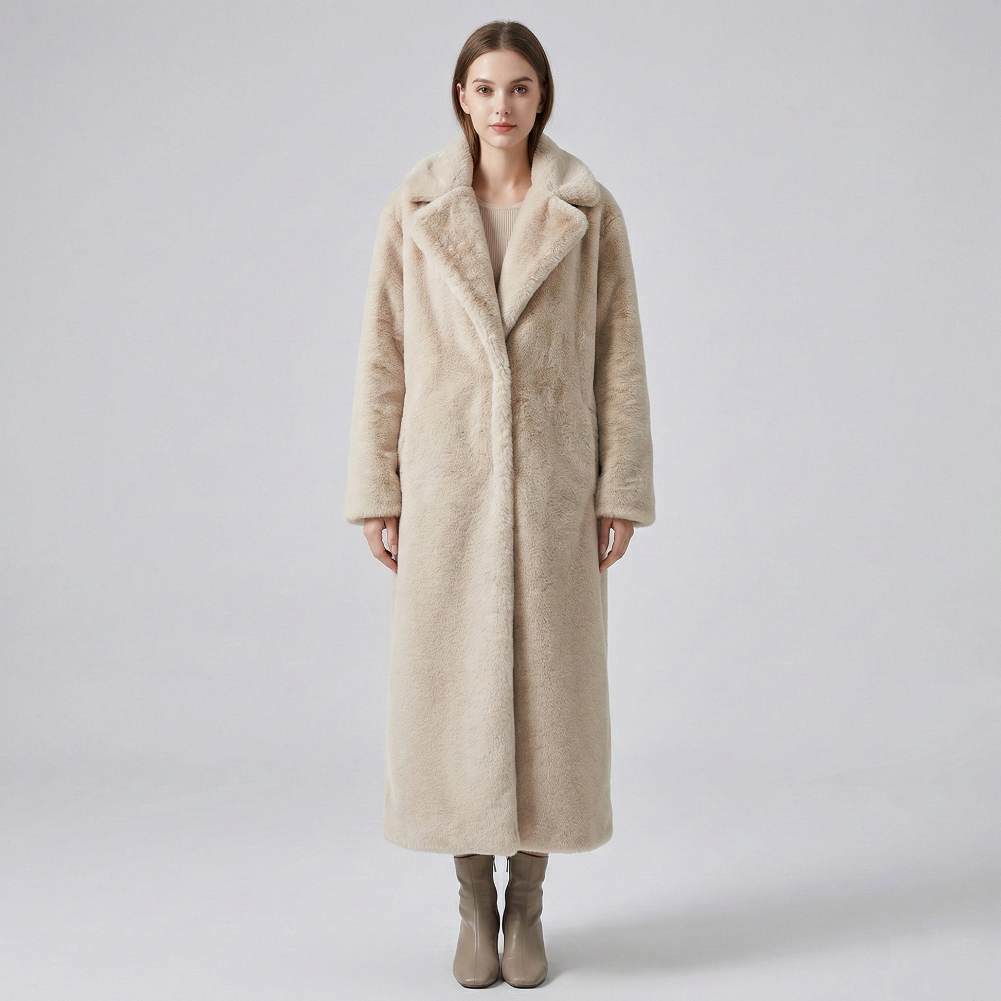 Woman wearing a long beige coat with a fur collar on a white background